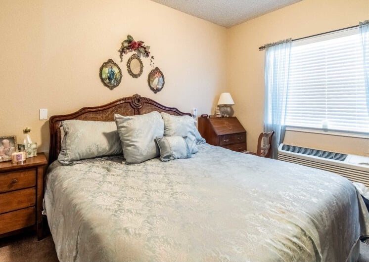 Comfortable Bed in Assisted Living Apartment