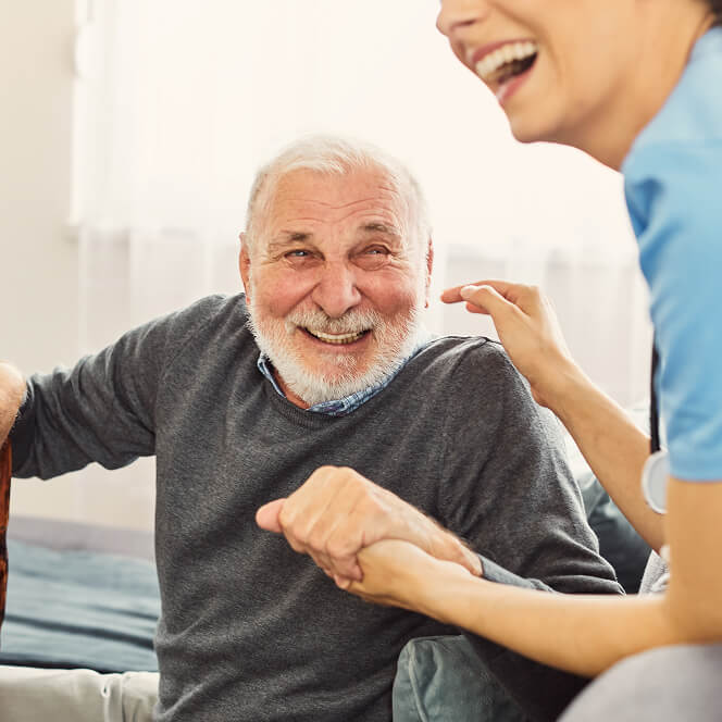 Caregiver Comforting Resident at Assisted Living Facility