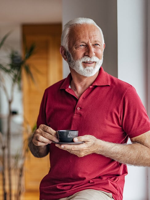 Elderly Man Smiling at Nursing Home in Oxford